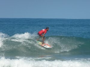 Improve your technique or learn how to surf at Cocles beach, minutes from Geckoes Lodge